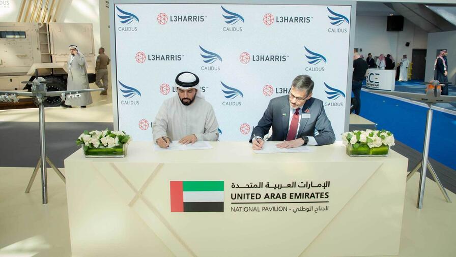 Khalifa Murad AlBlooshi, Chief Executive Officer of Calidus (left), and David Johnson, Corporate VP of L3Harris International sign an agreement at the World Defense Show to grow business offerings in the UAE and MENA regions.