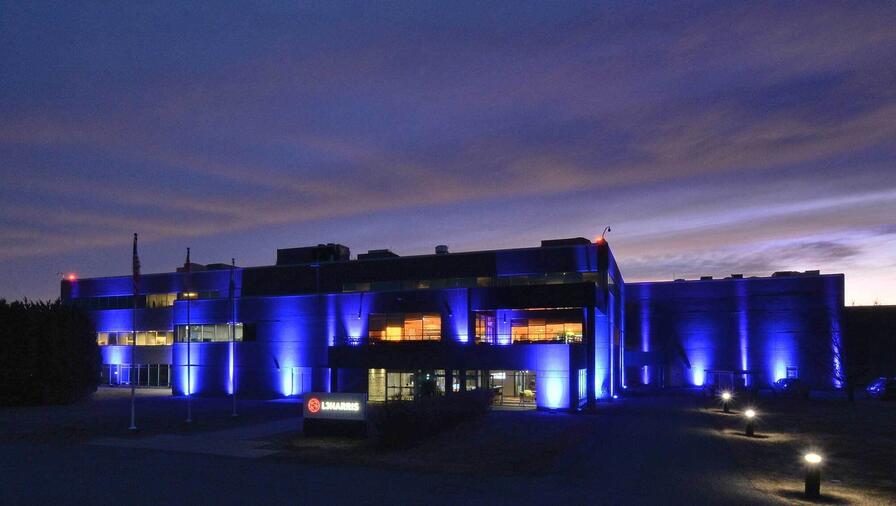 RCAF Blue Light Celebration with light on L3Harris facility