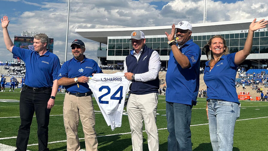 L3Harris representatives received a commemorative jersey from the U.S. Air Force Academy Athletic during L3Harris Night in Falcon Stadium.