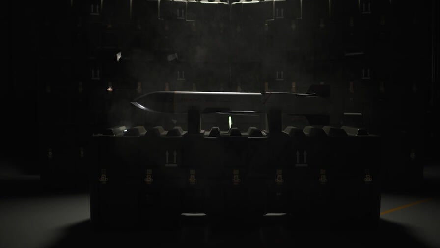 L3Harris' Launched Effects, Meet the "Wolf Pack" video still frame showing Red Wolf™ on display in darkened room resting on packing crates