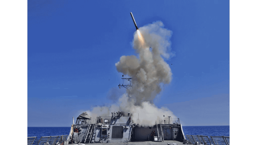 Destroyer U.S.S. Barry launches a Tomahawk cruise missile from the ship's bow.