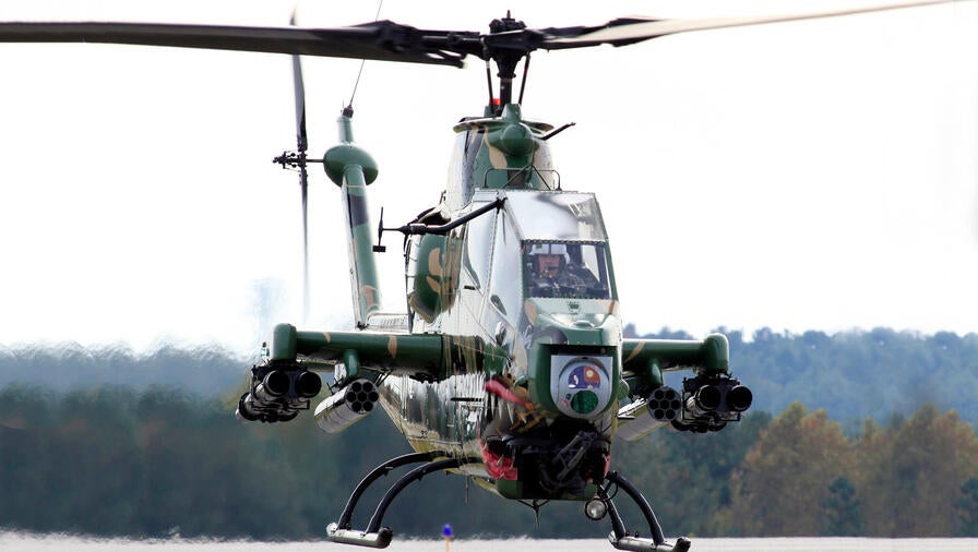 Helicopter hovering over tarmac