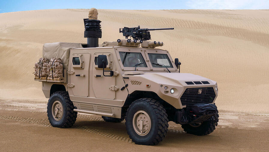 Armored vehicle still on the desert sand
