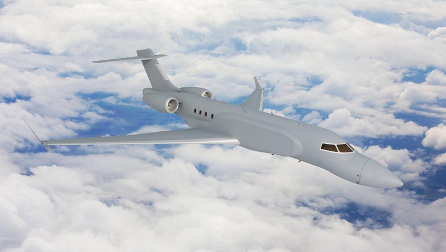 L3Harris' concept graphic of the right side, forward view of the AERIS X Bombardier Global 6500 Variant in flight with sky and cloud background